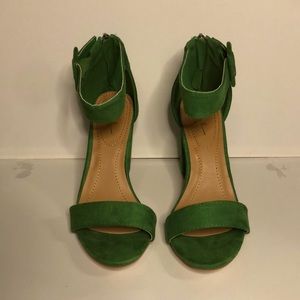 Kelly green 3” heels, buckle ankle strap with zipper on the back of the heel.